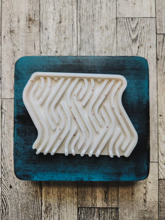 White soap dish on a blue wooden stand