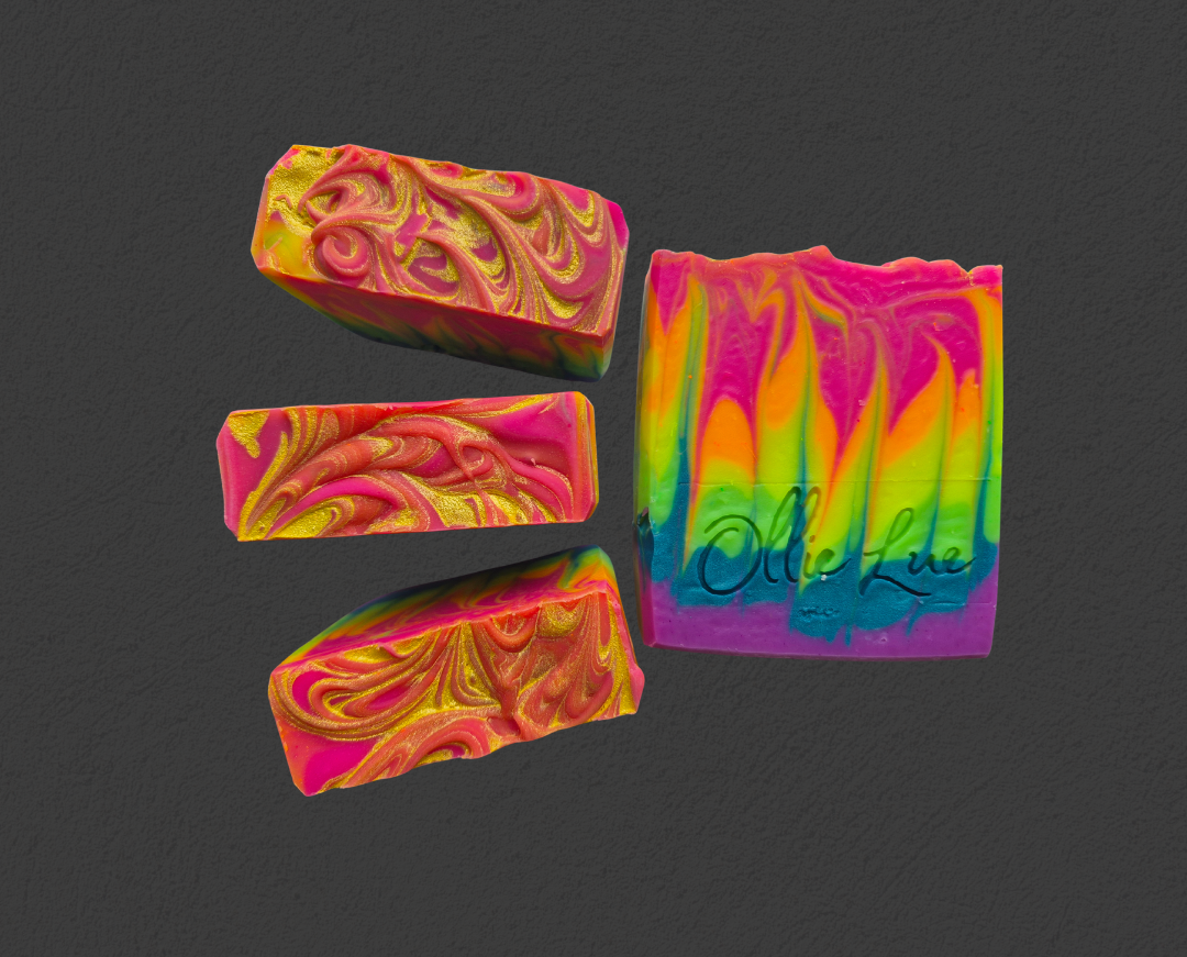 Neon rainbow soap bars on a dark background with 'Ollie Lue' branding.