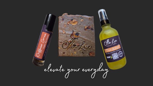 caffeine serum, bar of soap, and bottle of face wash on a dark background