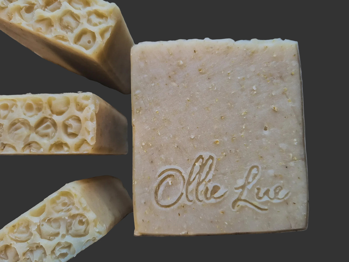 Bar of oat soap with 'Ollie Lue' branding on a dark background