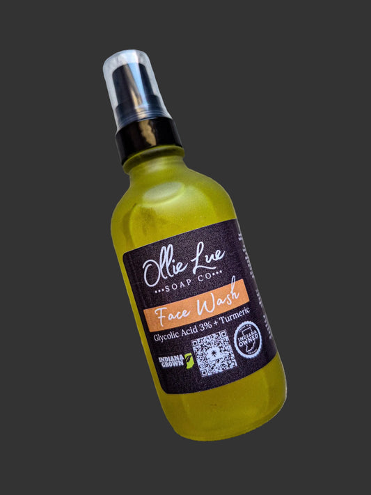 Bottle of face wash with a label on a dark background