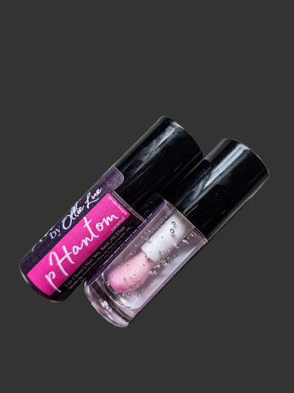 Two lip glosses with pink labels on a gray background