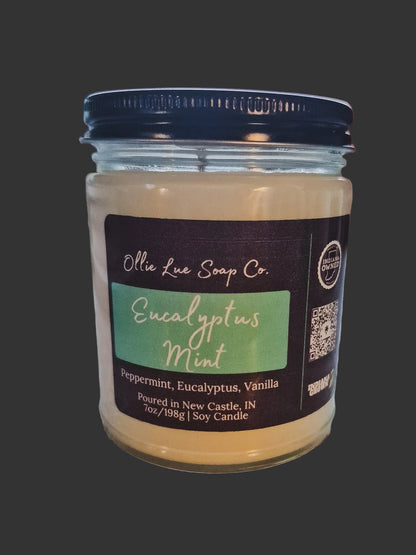 Jar of Eucalyptus Mint Candle Ollie Lue Soap Co. candle with label on a dark background