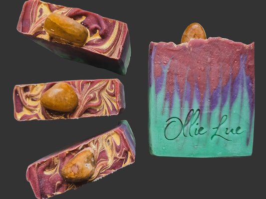 red, purple and green soap topped with a sandstone gem all stamped ollie lue