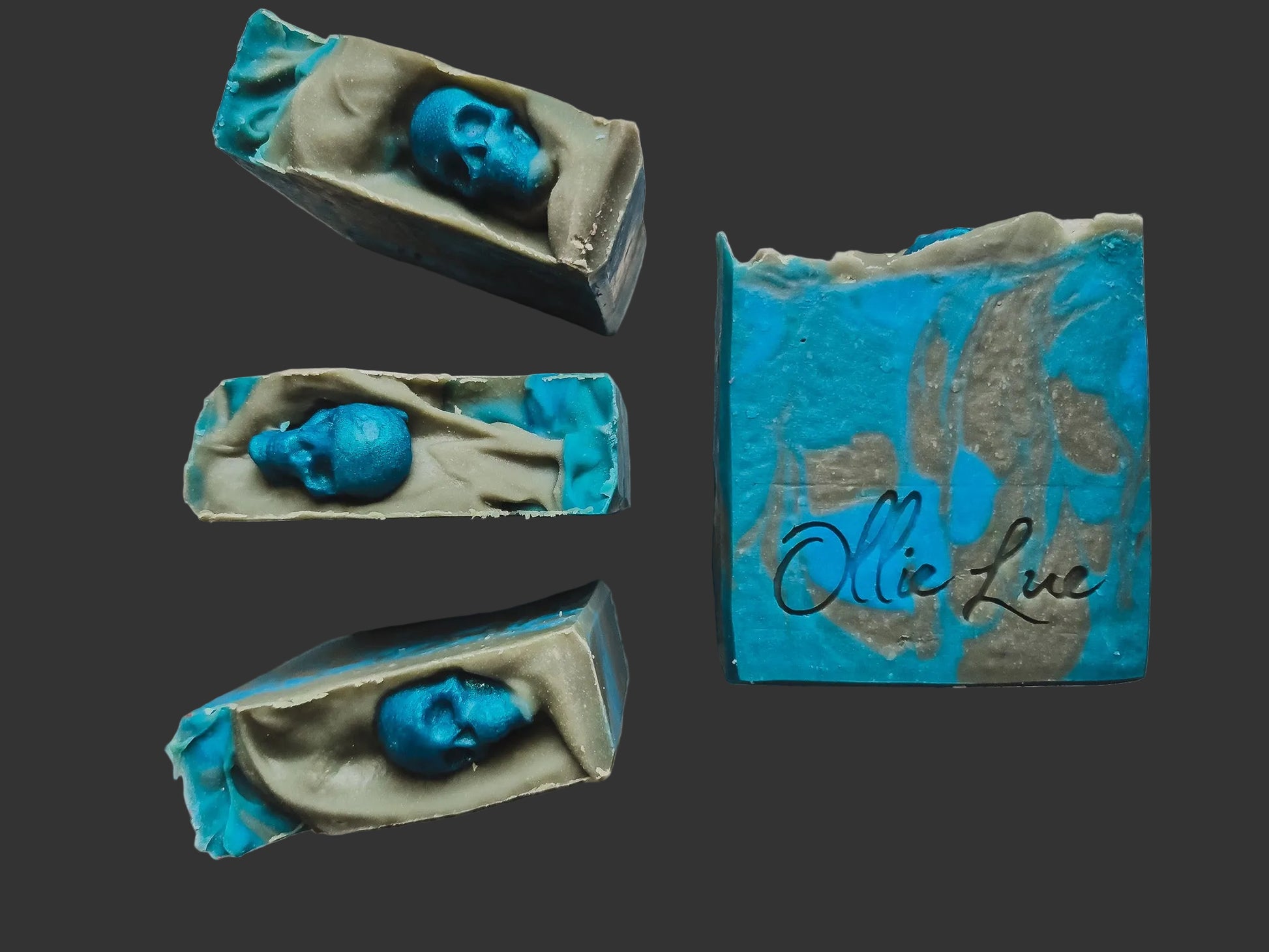 blue and gray swirled soap topped with a blue soap skull all stamped ollie lue