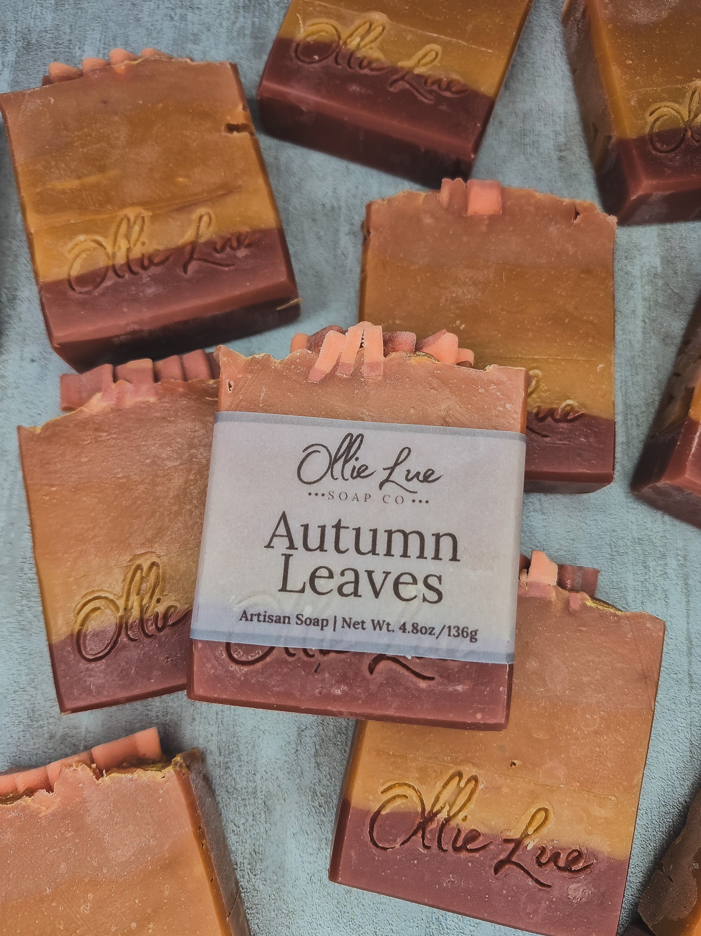 autumn leaves labeled soap on a gray backgound