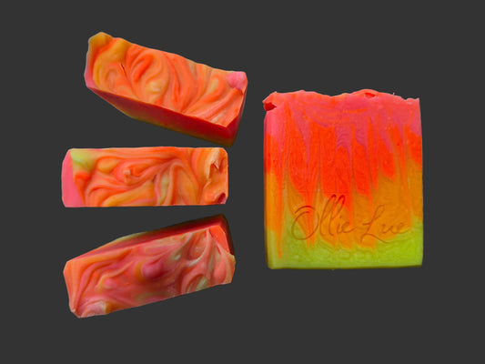 bright orange ombre soap on a dark background stamped ollie lue 