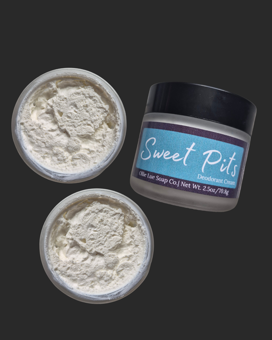 Two containers of 'Sweet Pits' deodorant cream with a jar on a dark background